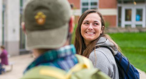 Three students walking together on campus